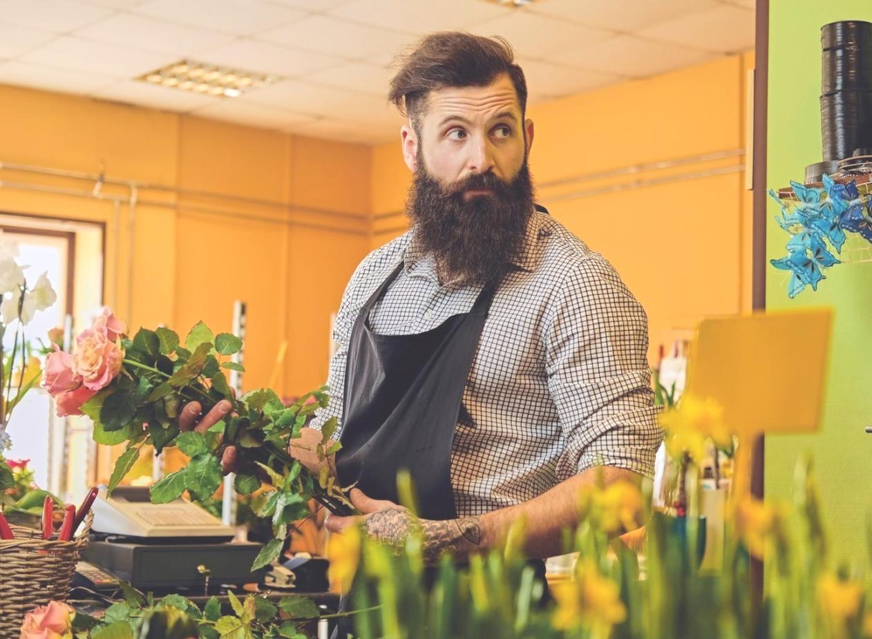 Professional floral arrangement demonstration showing advanced design techniques